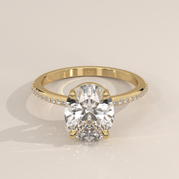 Pavé Band Solitaire in 14k Yellow Gold with a oval cut diamond