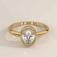Bezel Solitaire in 14k Yellow Gold with a oval cut diamond