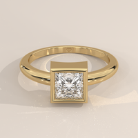 Bezel Solitaire in 14k Yellow Gold with a princess cut diamond