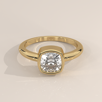 Bezel Solitaire in 14k Yellow Gold with a cushion cut diamond
